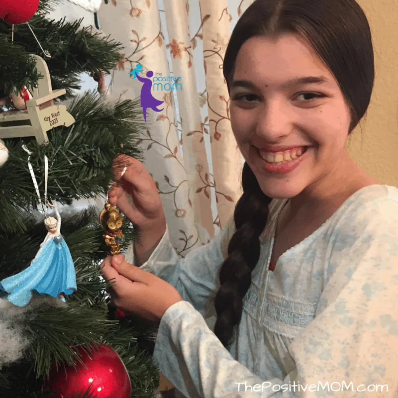 Elisha excited about her C3PO tree ornament and StarWars
