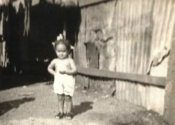 Elayna Fernandez - childhood photo in a Dominican Republic slum