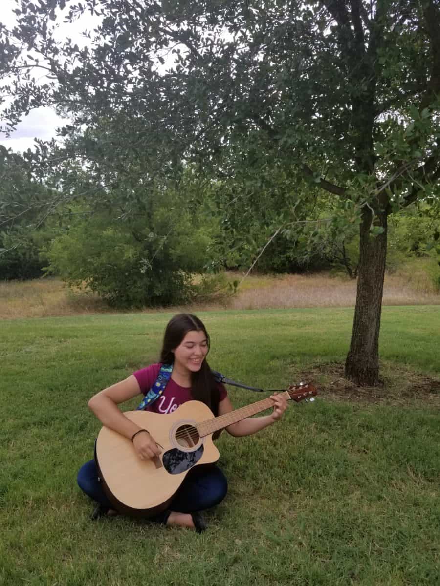 Drug free teen Elisha playing guitar - Pursue greatness