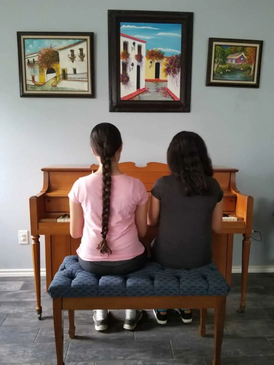 Drug free teens Elisha and Elyssa playing piano - Pursue greatness