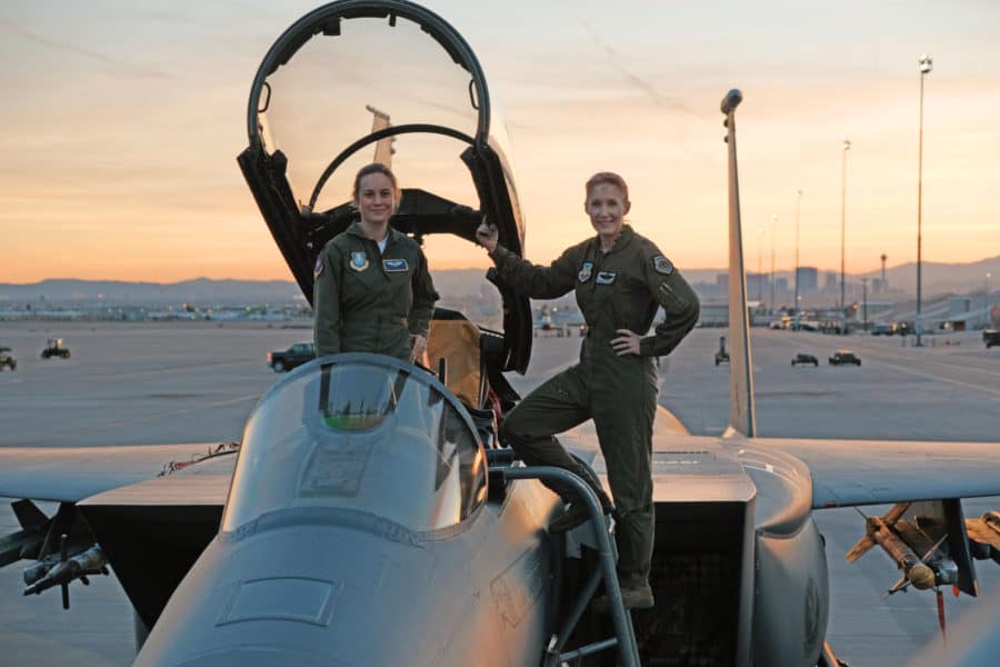 Marvel Studios' CAPTAIN MARVEL  Brie Larson (left) gets hands-on help from Brigadier General Jeannie Leavitt, 57th Wing Commander (right), on a recent trip to Nellis Air Force Base in Nevada to research her character, Carol Danvers aka Captain Marvel, for Marvel Studios’ “Captain Marvel.”  Photo: Brad Baruh  ©Marvel Studios 2019