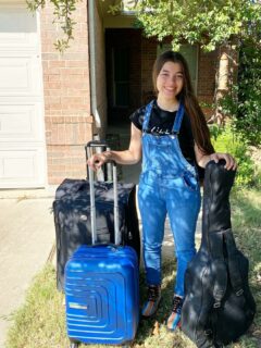 Daughter with suitcases college-bound