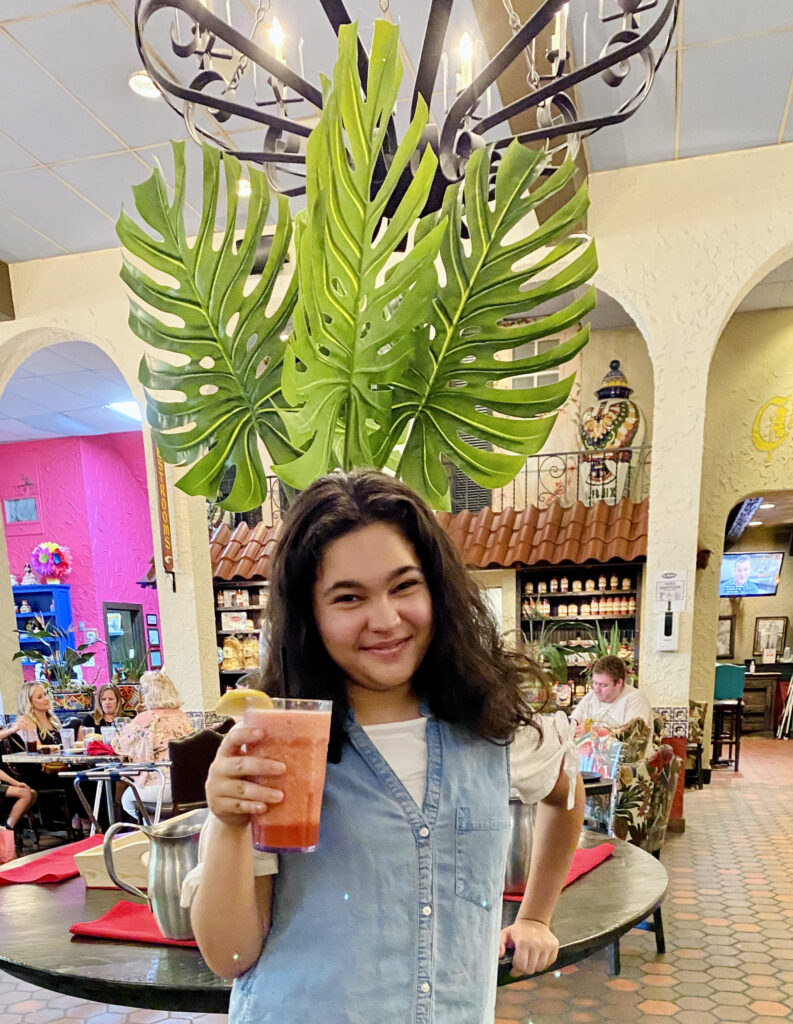 Hispanic Heritage Month Hispanic Heritage Trail Chevrolet Elyssa enjoying jugo at El Fenix the original oldest restaurant in Dallas 2021 Chevy Silverado